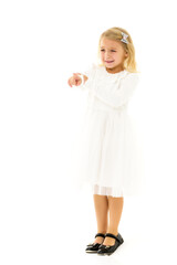 A little girl cries, points a finger at something.