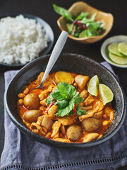 thai massaman curry with chicken and potatoes in bowl