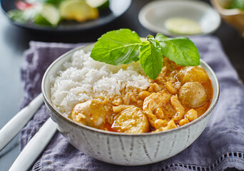 thai massaman chicken curry in bowl with jasmine rice