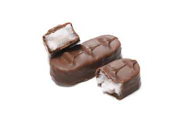 A slice of milk chocolate with coconut filling and broken in half