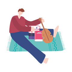 stay at home, young man with book and violin sitting on floor, self isolation, activities in quarantine for coronavirus