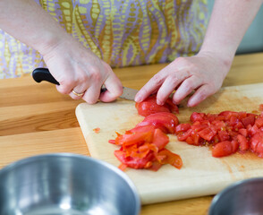 Preparing tomatoes.