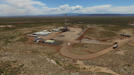Vaca Muerta, Argentina, December 25, 2016: Extraction of unconventional oil. Battery of pumping trucks for hydraulic fracturing (Fracking).