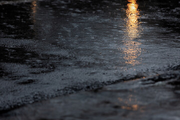 Rainy night in the city,  view from the level of asphalt.