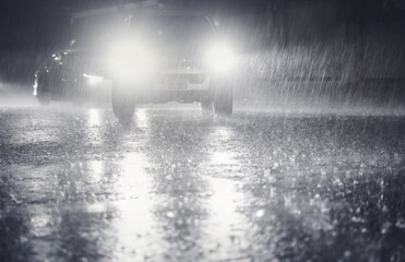 Night scene of hard rain fall in the city.Selective focus and shallow depth of field composition.