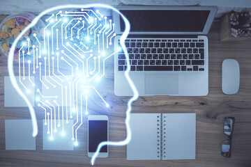 Double exposure of brain drawing hologram over topview work table background with computer. Concept of big data.