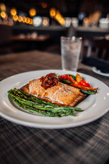 grilled salmon steak with vegetables at a restaurant 