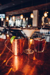 various cocktails on a bar at a restaurant