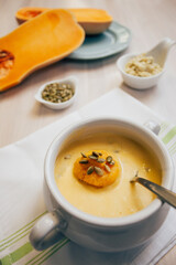 pumpkin soup served with various toppings 