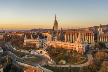 Aerial drone shot of Matthias Church on Buda hill during Budapest sunrise at dawn