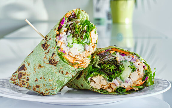 healthy green lettuce and chicken salad wrap