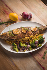whole roasted mullet, brocolles, onions and dehydrated orange slices