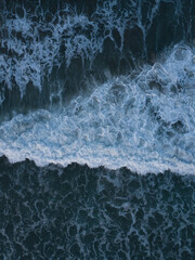 Aerial photo of waves breaking near a rural surf beach, New Zealand. 