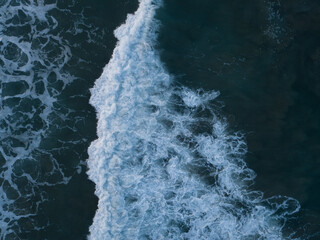 Aerial photo of waves breaking near a rural surf beach, New Zealand. 