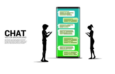 Silhouette of man and woman standing with bubble speech on mobile phone. concept of chat bot engine and communication.