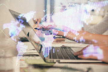 Multi exposure of woman hands typing on computer and business theme hologram drawing. Success...