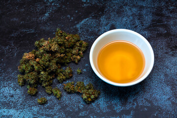 Cannabis buds with bowl of canna tea-2