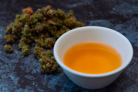 Cannabis buds with bowl of canna tea-3