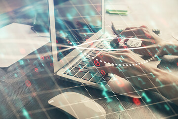 Double exposure of woman hands typing on computer and forex chart hologram drawing. Stock market invest concept.