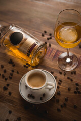 Carajillo cocktail, Spanish drink with 43 and coffee, with wooden table