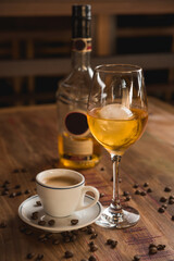 Carajillo cocktail, Spanish drink with 43 and coffee, with wooden table