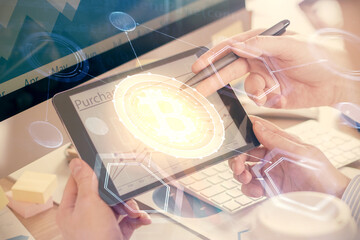Double exposure of man's hands holding and using a phone and crypto currency blockchain theme drawing.