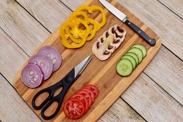Fresh wholesome vegetarian ingredients of organic vegetables arranged in simplistic and artistic knolling pattern to show attractive healthy ingredients