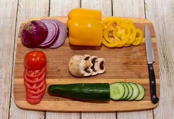 Fresh wholesome vegetarian ingredients of organic vegetables arranged in simplistic and artistic knolling pattern to show attractive healthy ingredients