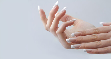 beautiful hands with manicured french nails manicure. nail extension - obrazy, fototapety, plakaty