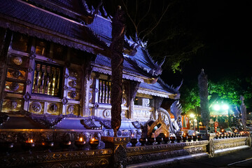 Chiang Mai, Thailand — 1 june 2020:  
wall of temple Wat Si Supan at night, in the light of a blue purple spotlight   