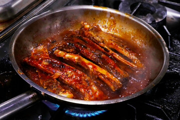  glazed pork baby ribs in a cooking pan