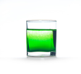 Green ink in water, color abstraction, color explosion in a glass.