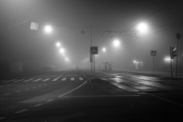 night road in fog, long exposure, black and white, dark image