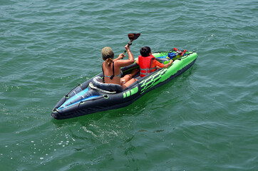Mother and her young son kayaking on Biscayne Bay off of Miami Beach,Florida