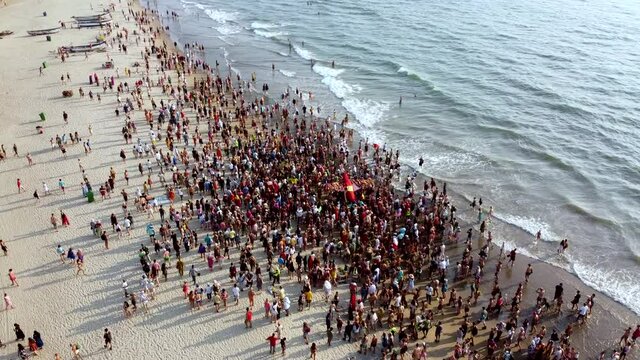 Arambol Goa India Freak Parade Carnival at the sunset beach drone fly over