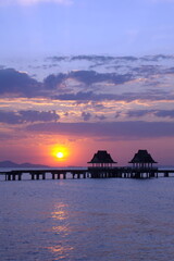 Wood bridge beautiful sunset.Wood bridge beautiful twilight sunset..Long bridge extends into the sea.Beautiful sunset.Beautiful sunrise. © oneSHUTTER oneMEMORY