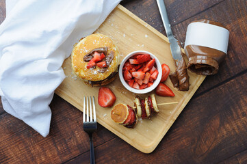 Ingredients for pancake on a wooden background. Prepared ingredients for baking. Top view