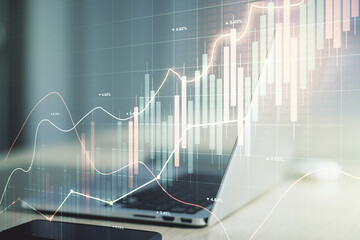 Abstract creative financial graph on modern laptop background, financial and trading concept. Multiexposure