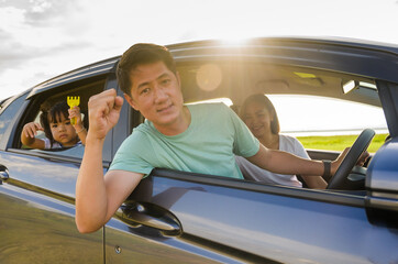 Naklejka premium Asian familie are happy outside the car.insurance concept
