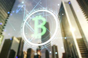 Double exposure of creative Bitcoin symbol hologram on modern skyscrapers background....