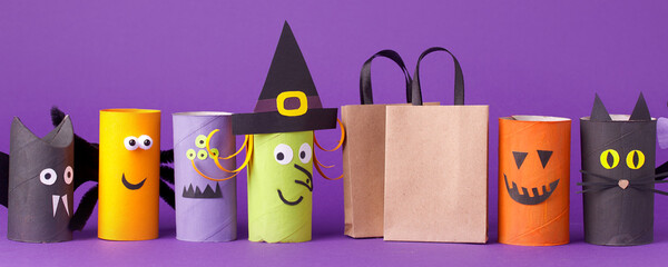 Autumn season Halloween holiday sale concept - toy from toilet roll tube? recycle idea and paper cragt shoppin bag on purple background, eco-friendly easy diy, flyer, coupon