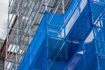 Blue mesh on scaffolding