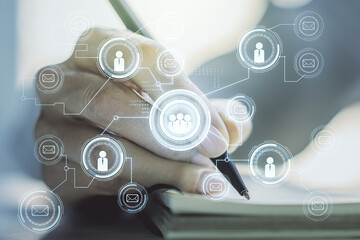 Social network media concept with woman hand writing in diary on background. Double exposure