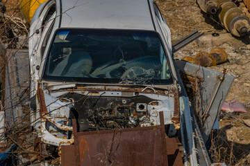 Fototapeta na wymiar Crashed automobile in junkyard