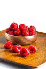 raspberries in a wooden cup