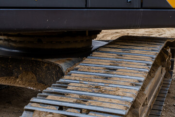 Track assembly of backhoe