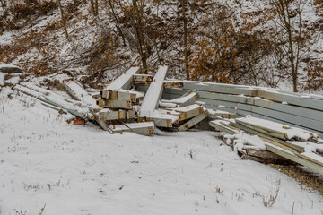 Metal girders laying in snow
