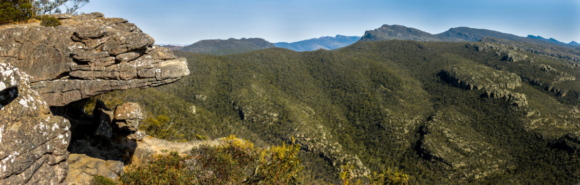 Panoramic view of the Balconies in the Grampians national park in regional Victoria highlands, with densely forested mountain ranges along the horizon.