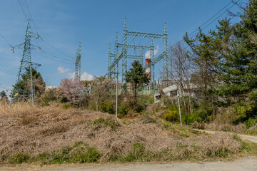 Obraz premium Electrical transformer towers in countryside