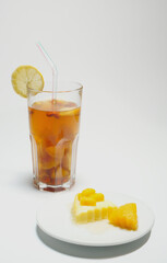 Mango pudding and iced tea with lemon, homemade refreshments, afternoon tea